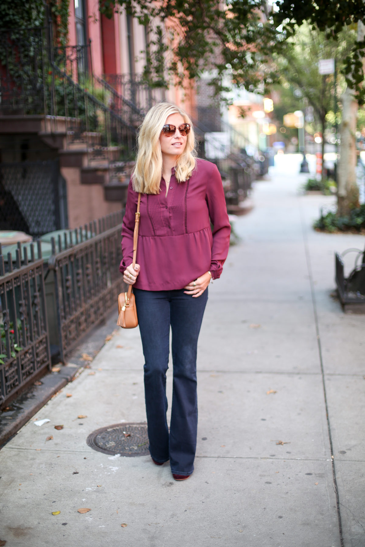burgundy color trend fall-burgundy long sleeve blouse-dark flare jeans-camel crossbody purse-kate spade cat eye sunglasses-dallas fashion blogger