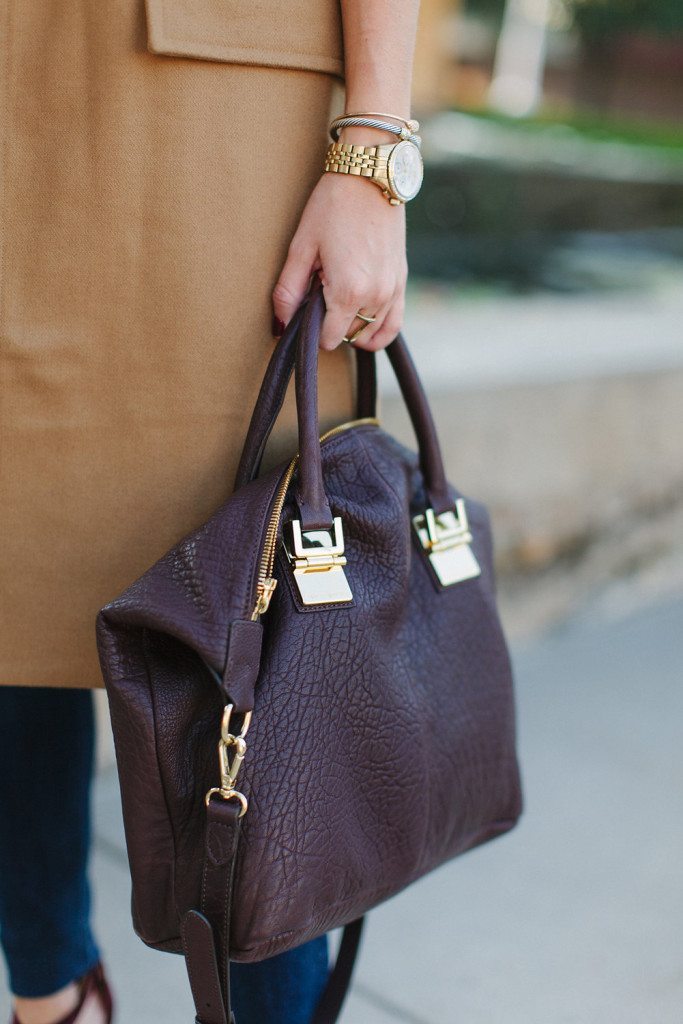 burgundy satchel with gold detail