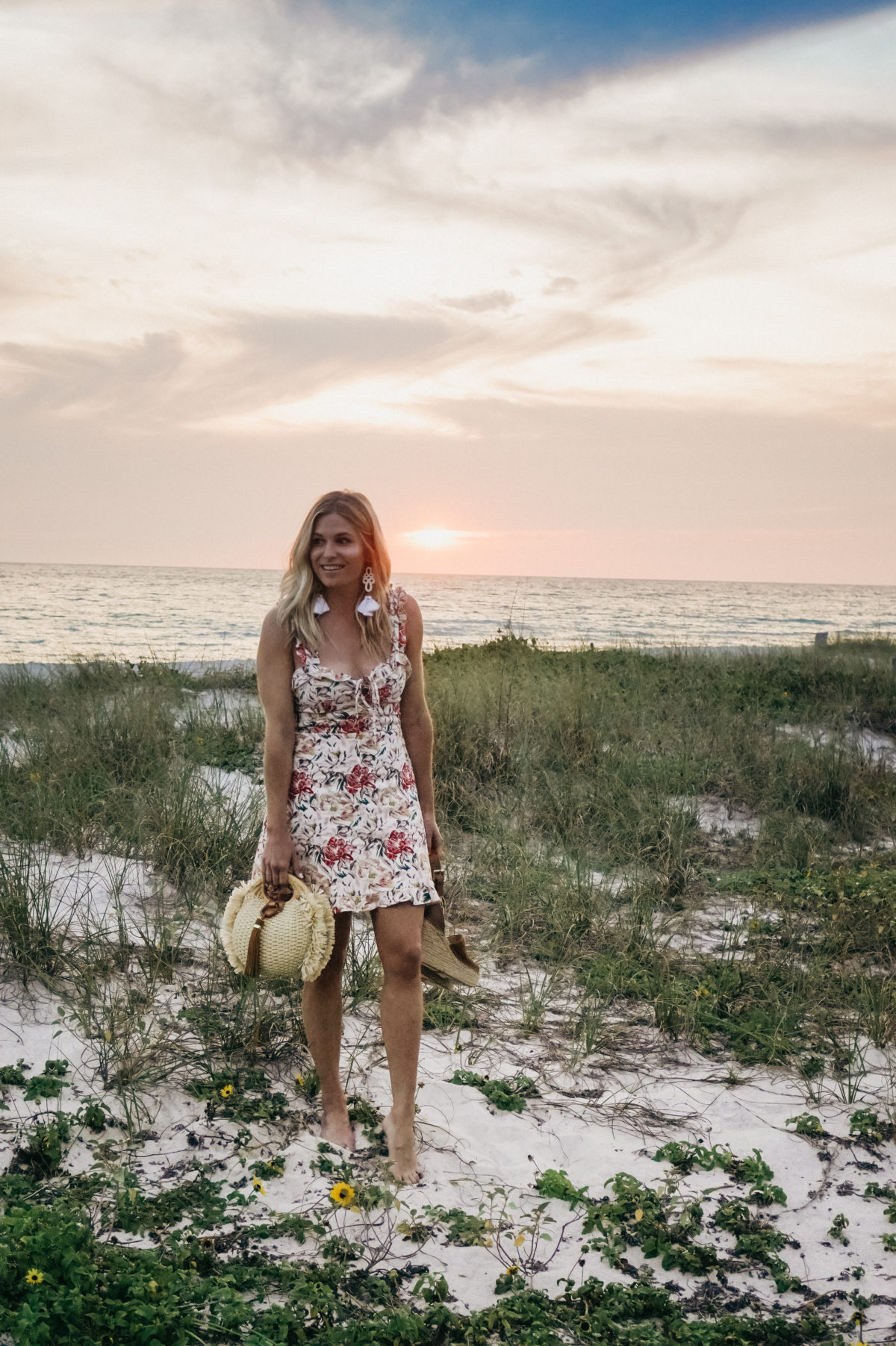 Brooke Burnett wearing floral mini dress on Florida beach