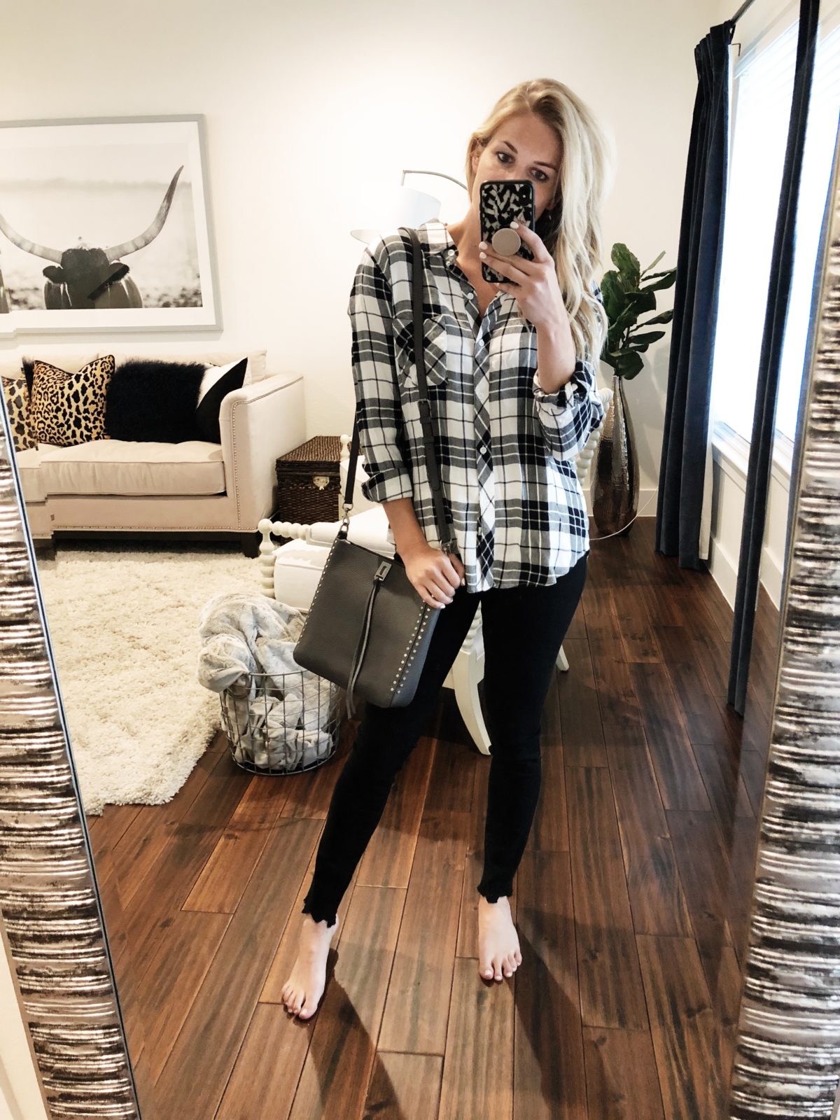woman wearing Rails Plaid Top, Rebecca Minkoff Small Crossbody  Frame Black Jeans in Size 25