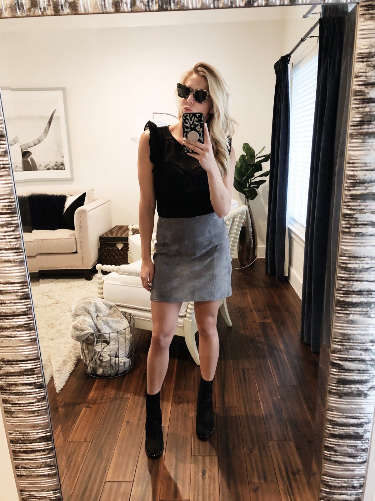 woman wearing Grey A-Line BLANKNYC Skirt in Size 26, Hinge Mixed Lace Peplum Top in Size S, and Sonix Sunglasses, and Rag & Bone Romie Chelsea Bootie in Size 7 1/2