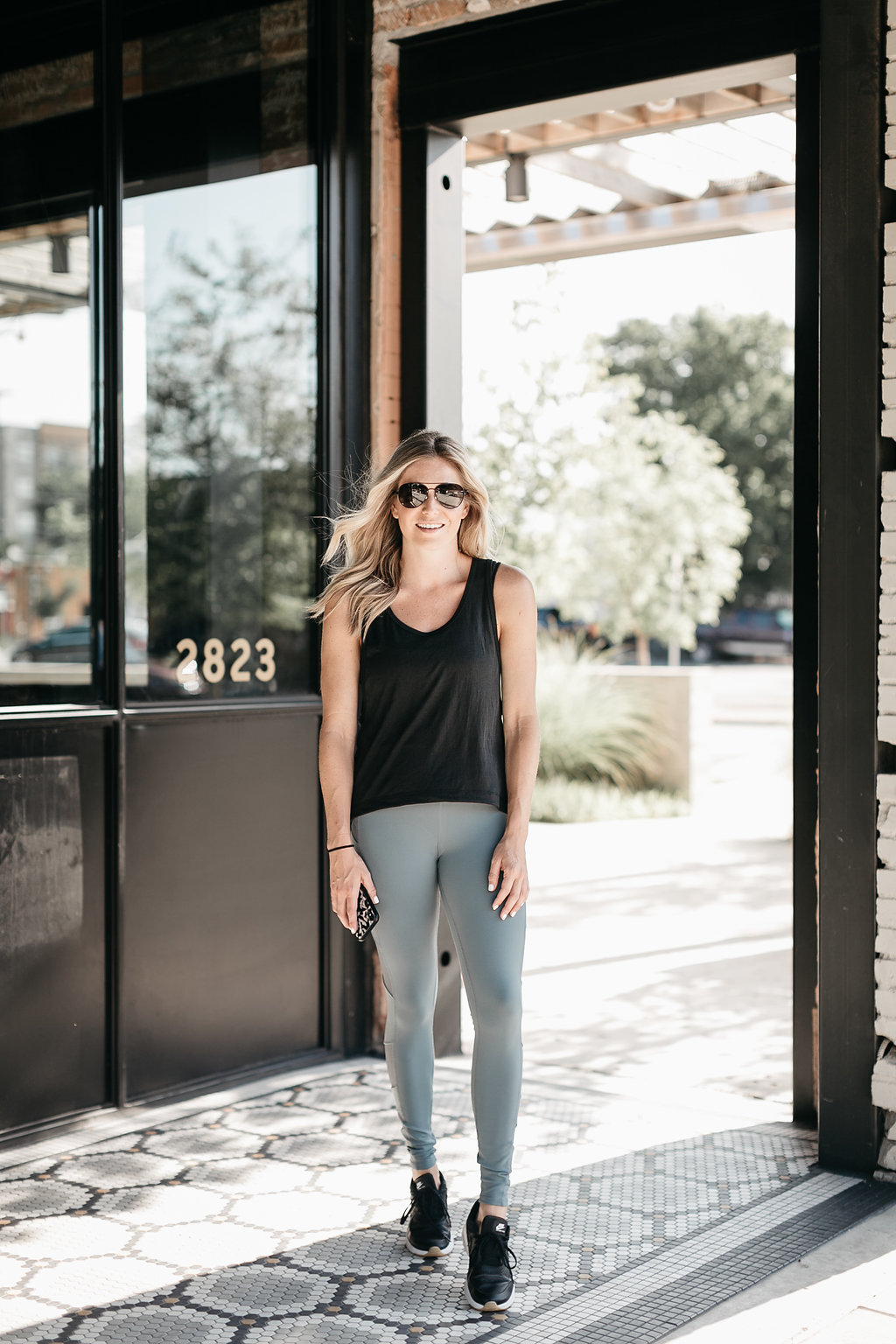 woman wearing workout outfits from nordstrom anniversary sale Weekend Traveler Crop Tank BEYOND YOGA / Block High Waist Mesh Inset Leggings ALO