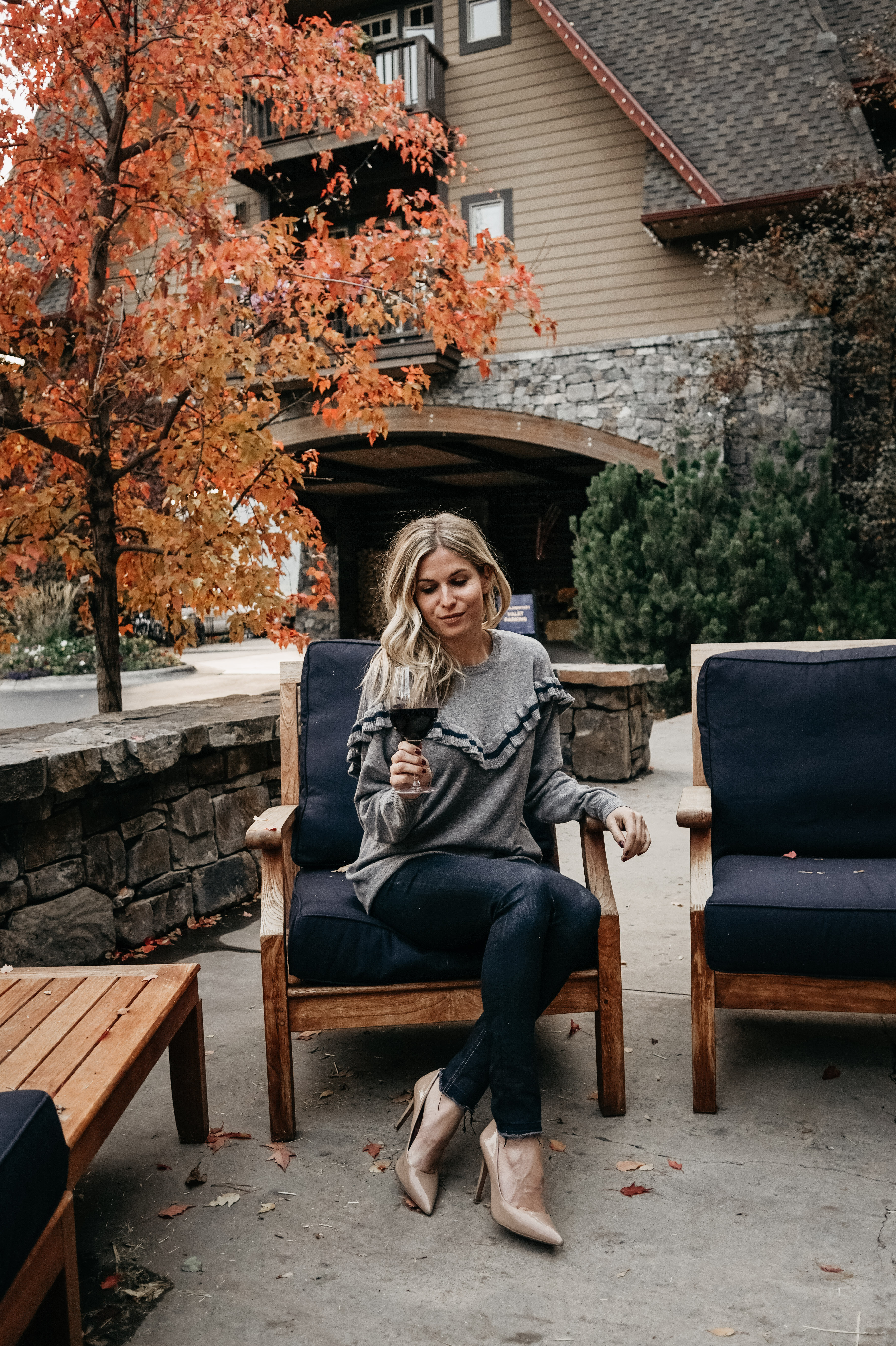 woman spending fall in Montana and drinking wine in the outdoors