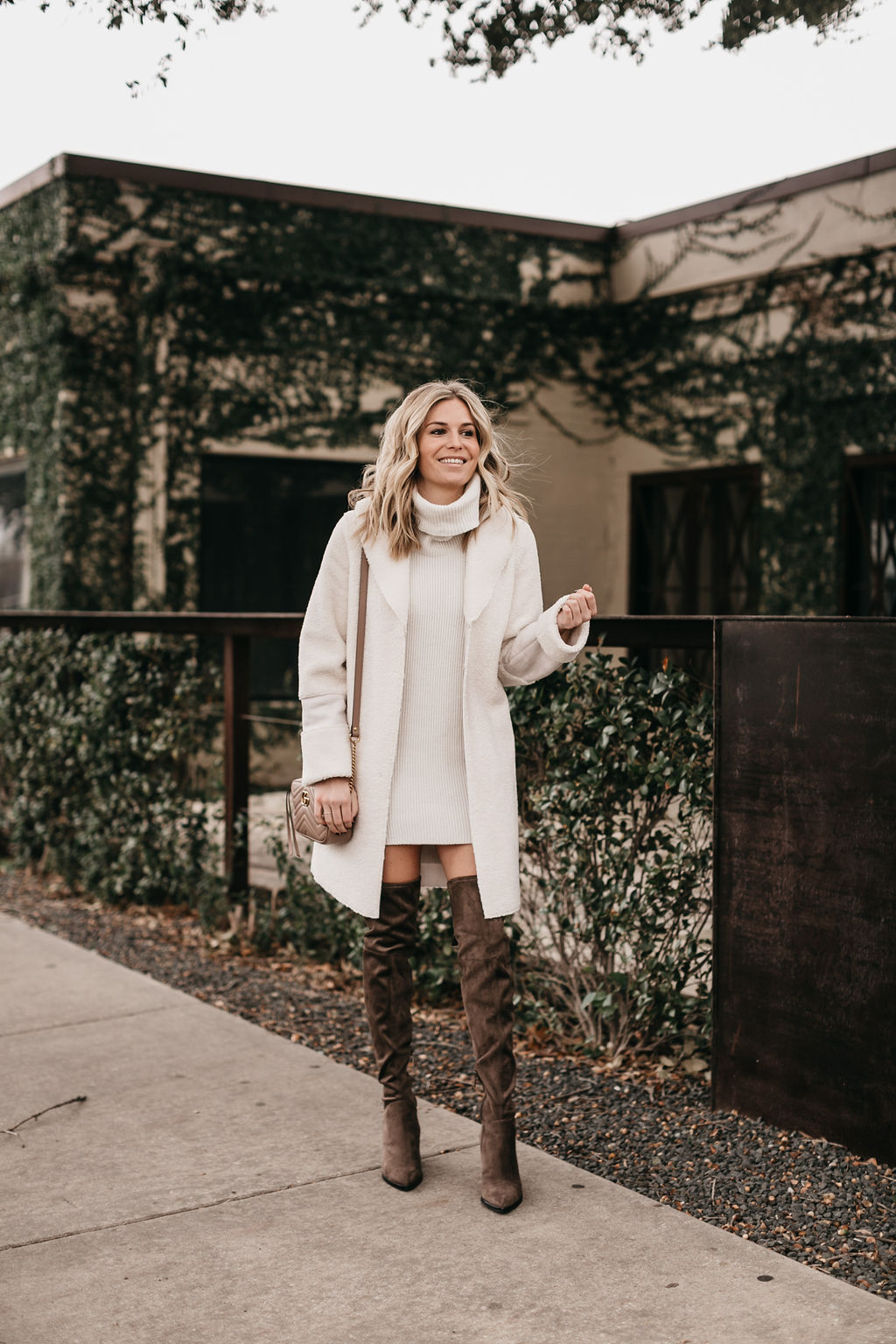 dallas fashion blogger, is wearing a white sweater dress and marc fisher over the knee boots