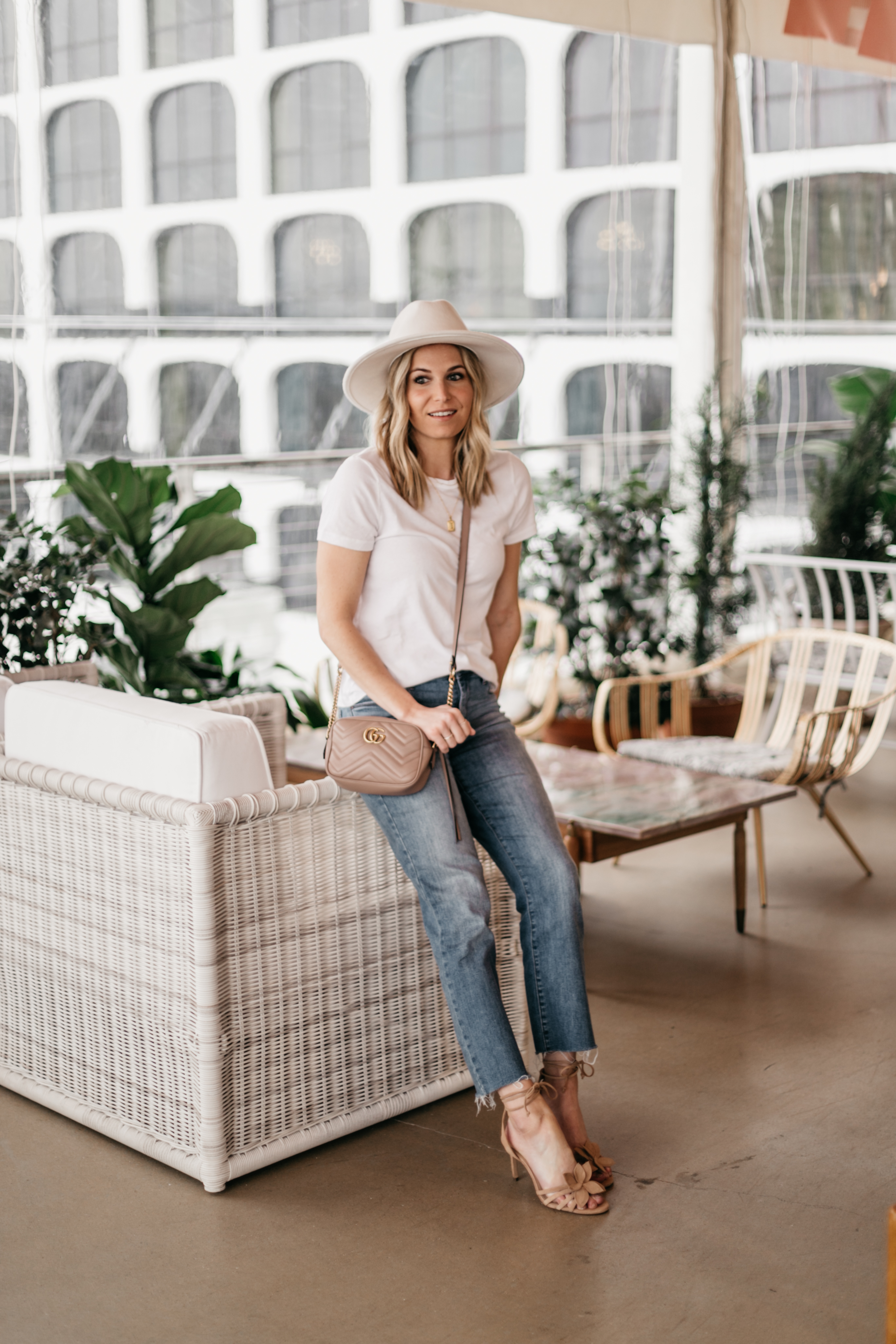 white hat and top, jeans, nude sandals and gucci bag outfit in Austin